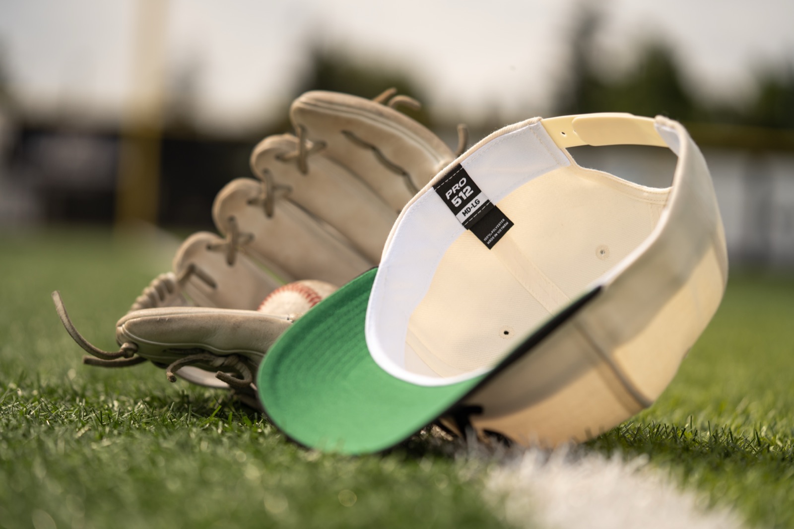 Richardson cap and glove on the infield grass